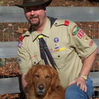 Dr. Erik Aanestad is pictured with a dog.