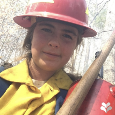 Selinde Roosenburg is pictured outdoors and in firefighting gear.