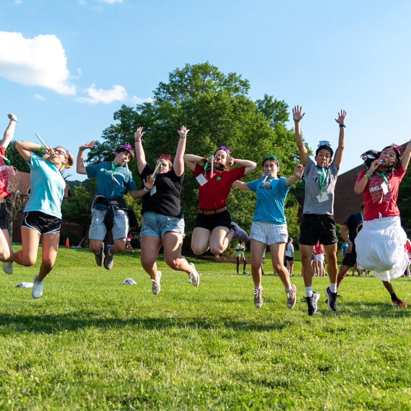 Pictured are children outside jumping into the air.