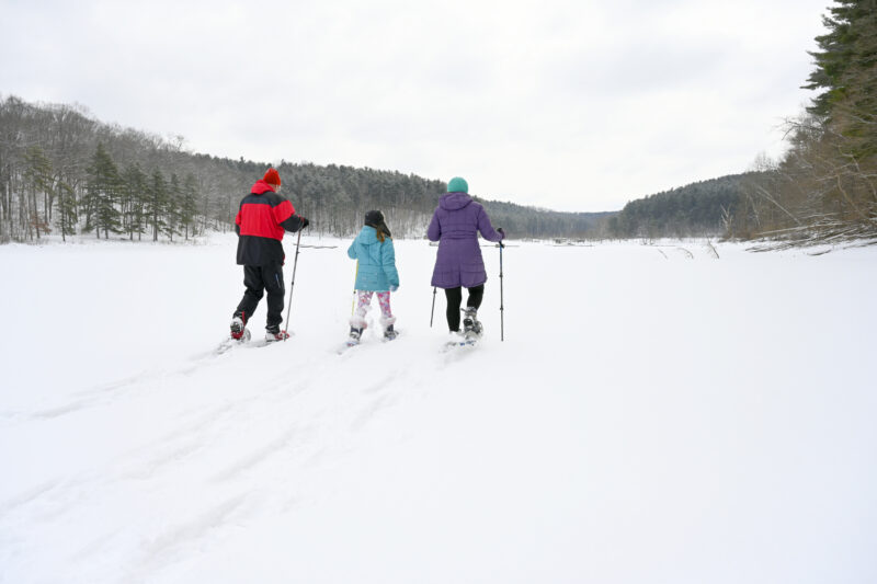 A family snowshoes at the Muskingum Watershed Conservancy District’s Tappan Lake.