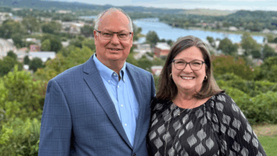 Bill McElfresh and Karen Lines are pictured on a hilltop overlooking the Ohio River.